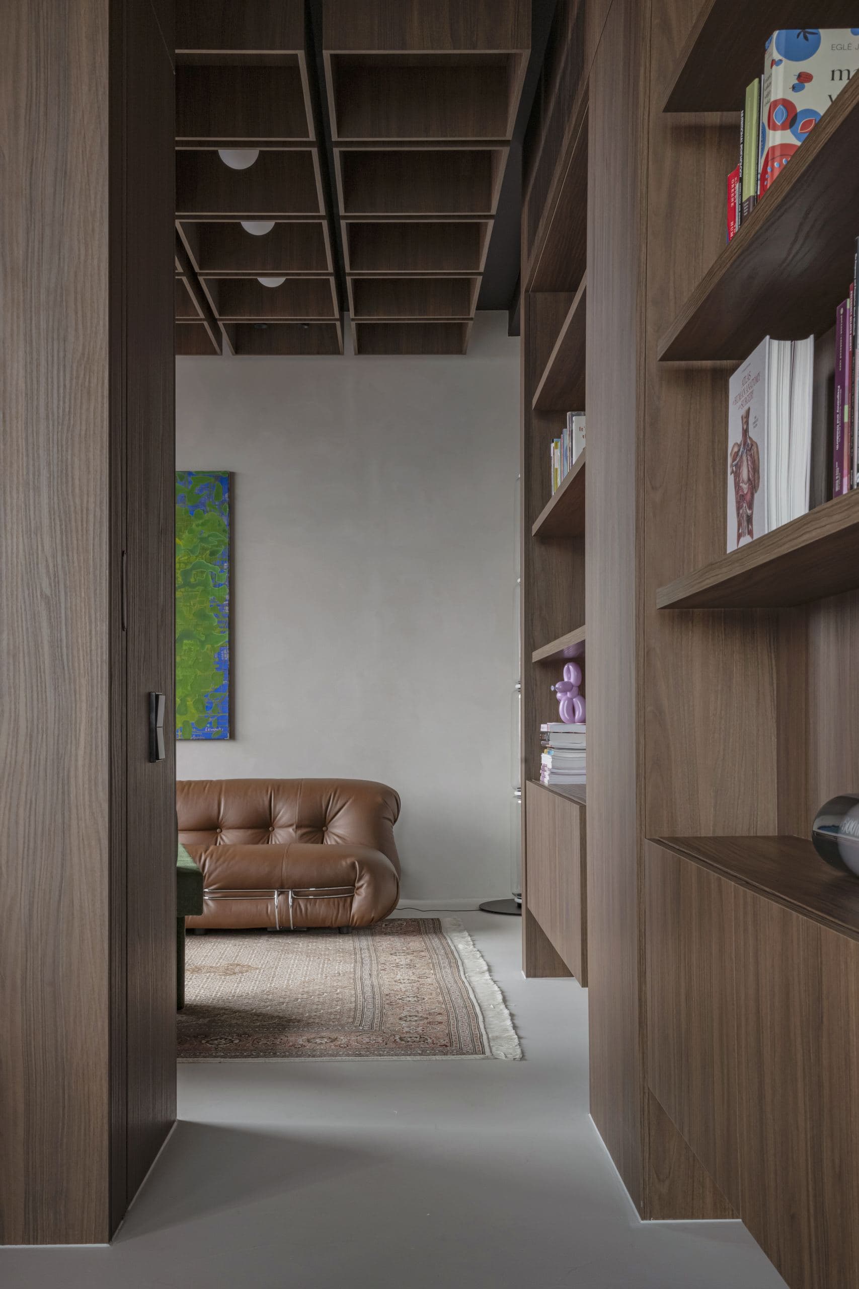 Bespoke Office Interior — leather armchair seen through an open walnut doorway