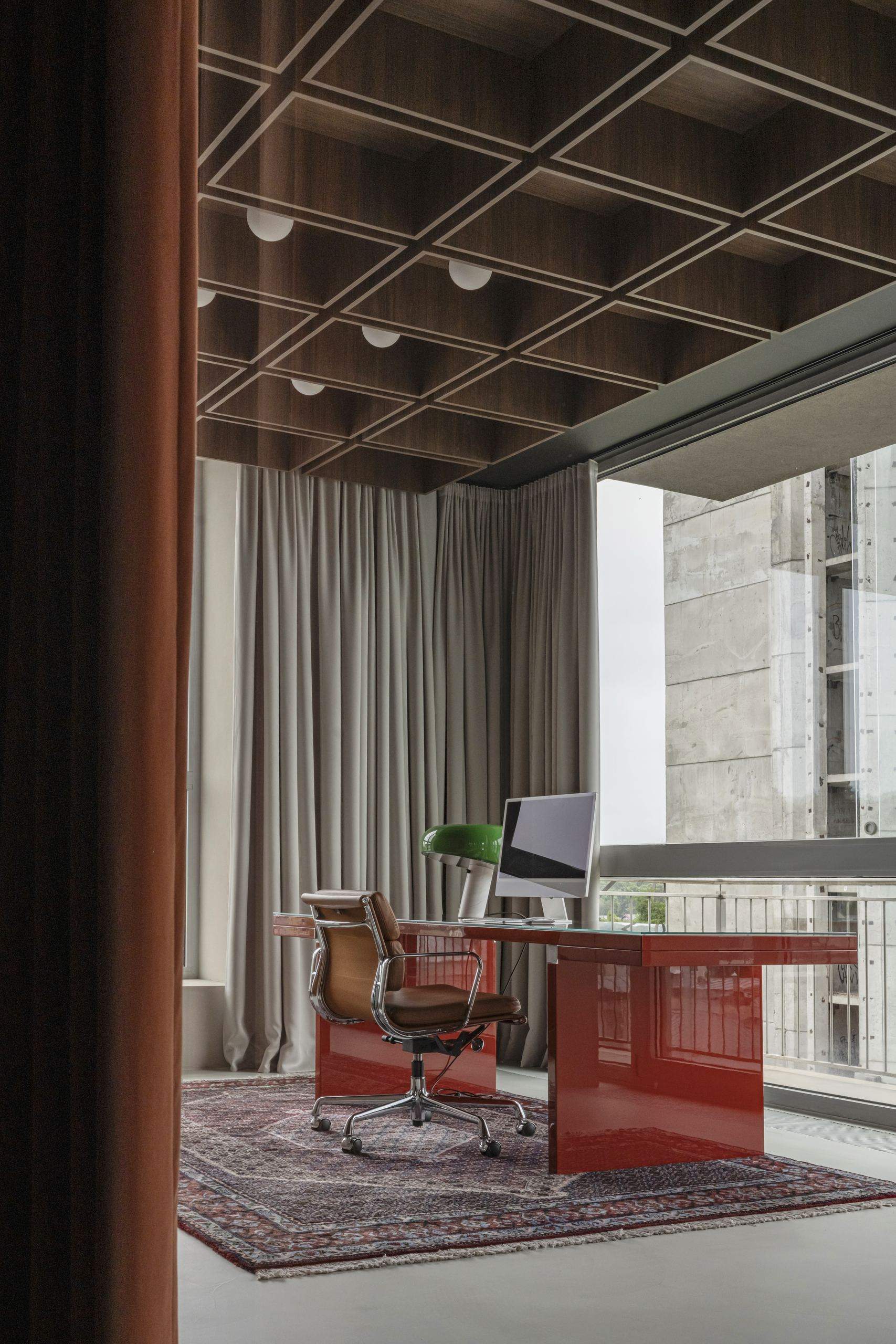 Bespoke Office Interior — coffered ceiling and draped curtains above a red desk and chair