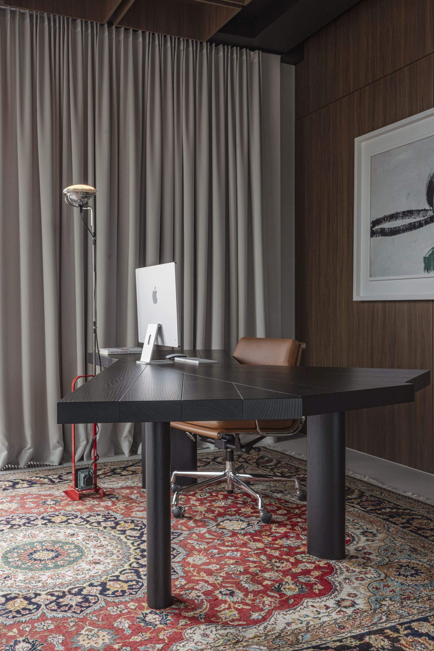 Bespoke Office Interior — desk lamp on a black desk set on a patterned rug