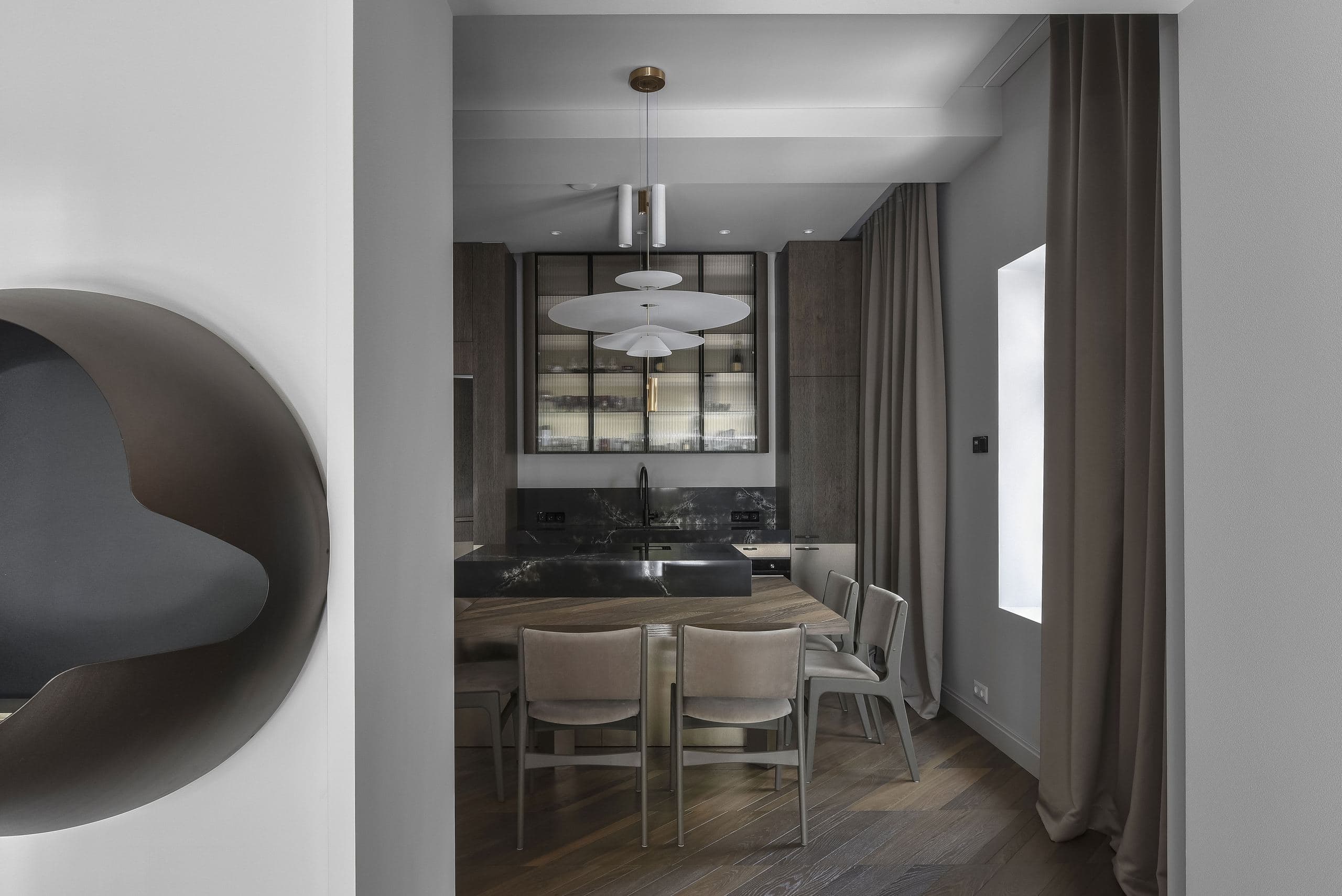 City Avenue Apartment — rounded mirrored doorway beside the dining area