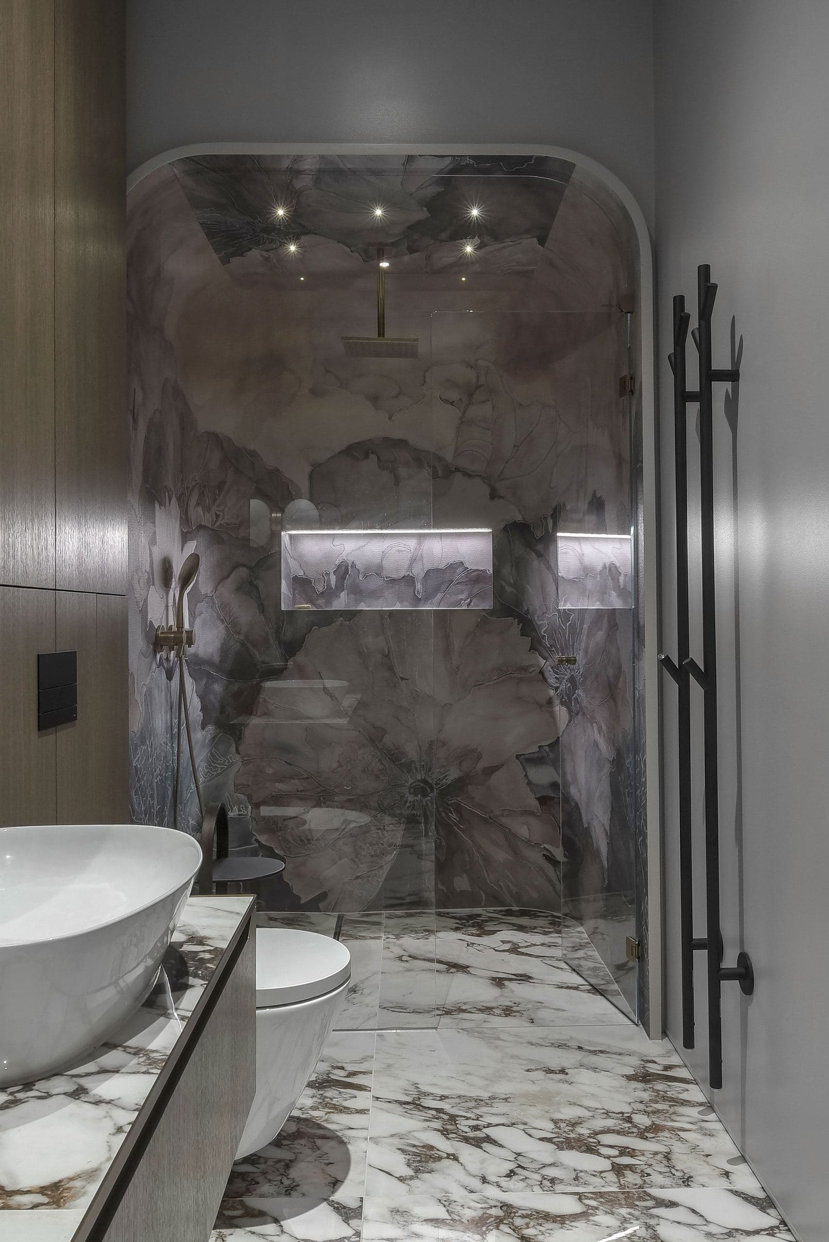 City Avenue Apartment — stone-clad bathroom niche with a freestanding basin