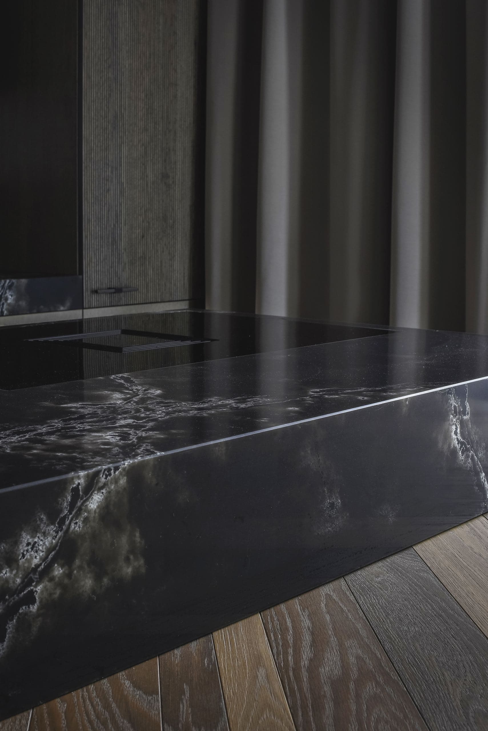 City Avenue Apartment — detail of a dark veined stone table top