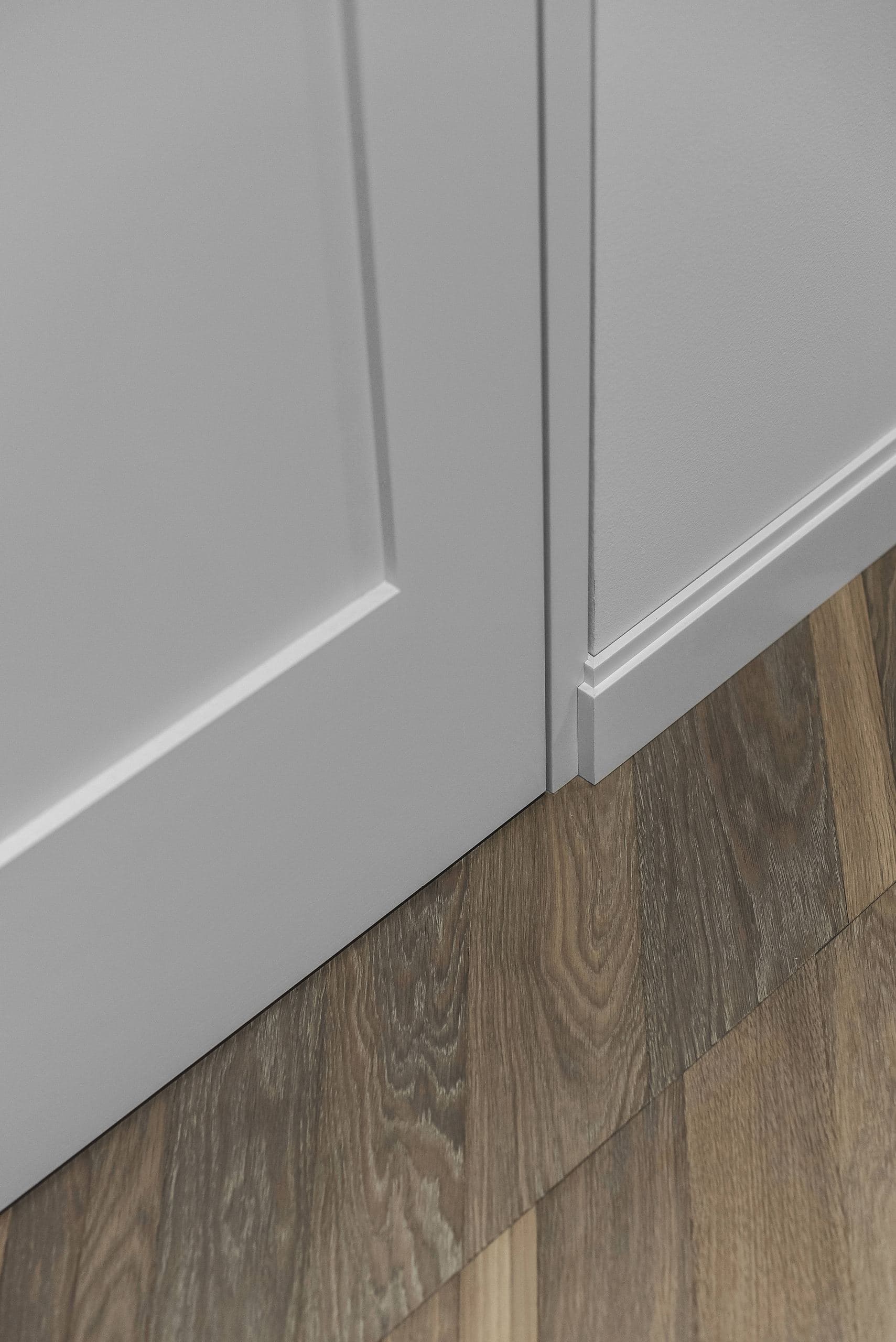 City Avenue Apartment — detail of panelled doors meeting a parquet floor