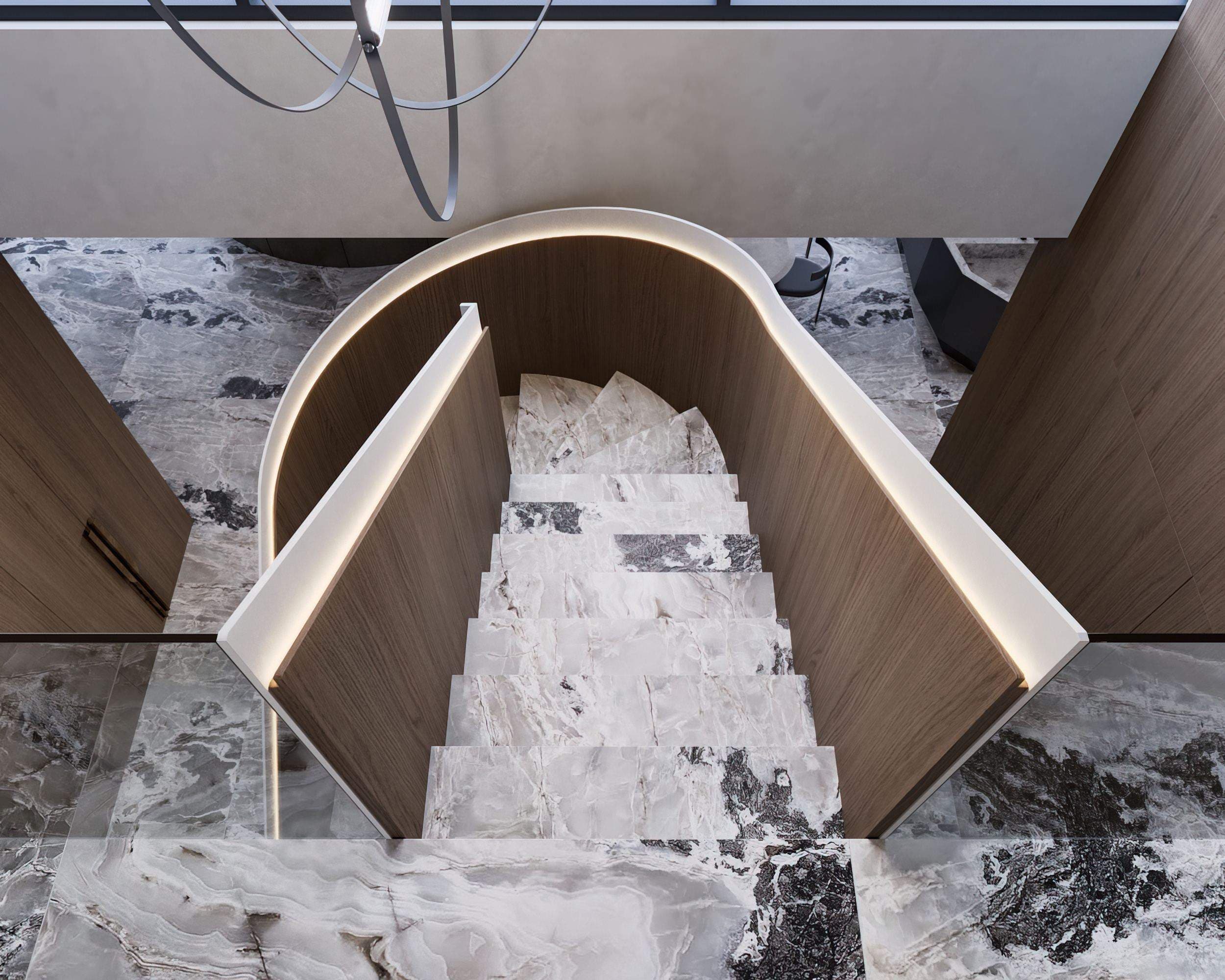 IN JAN House Interior — curved staircase profile meeting the veined stone floor