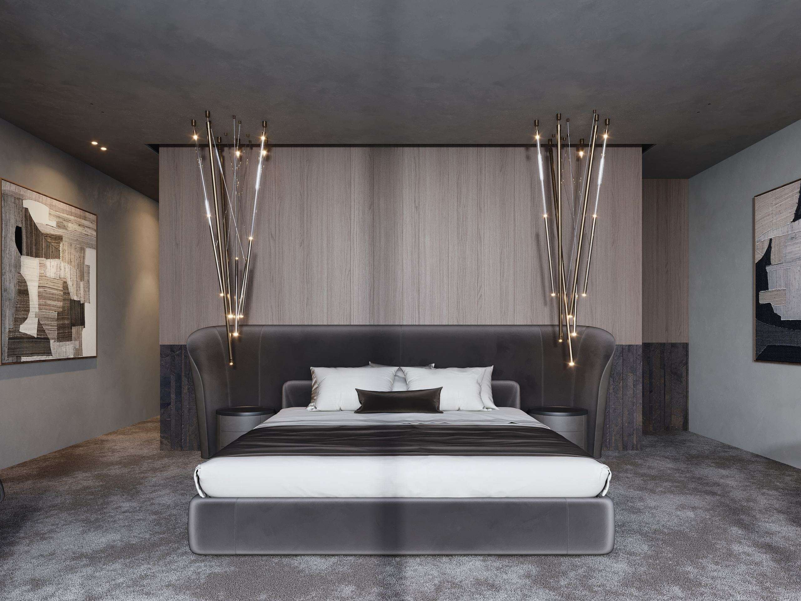 IN JAN House Interior — bed beneath pendant lights beside a veined stone wall