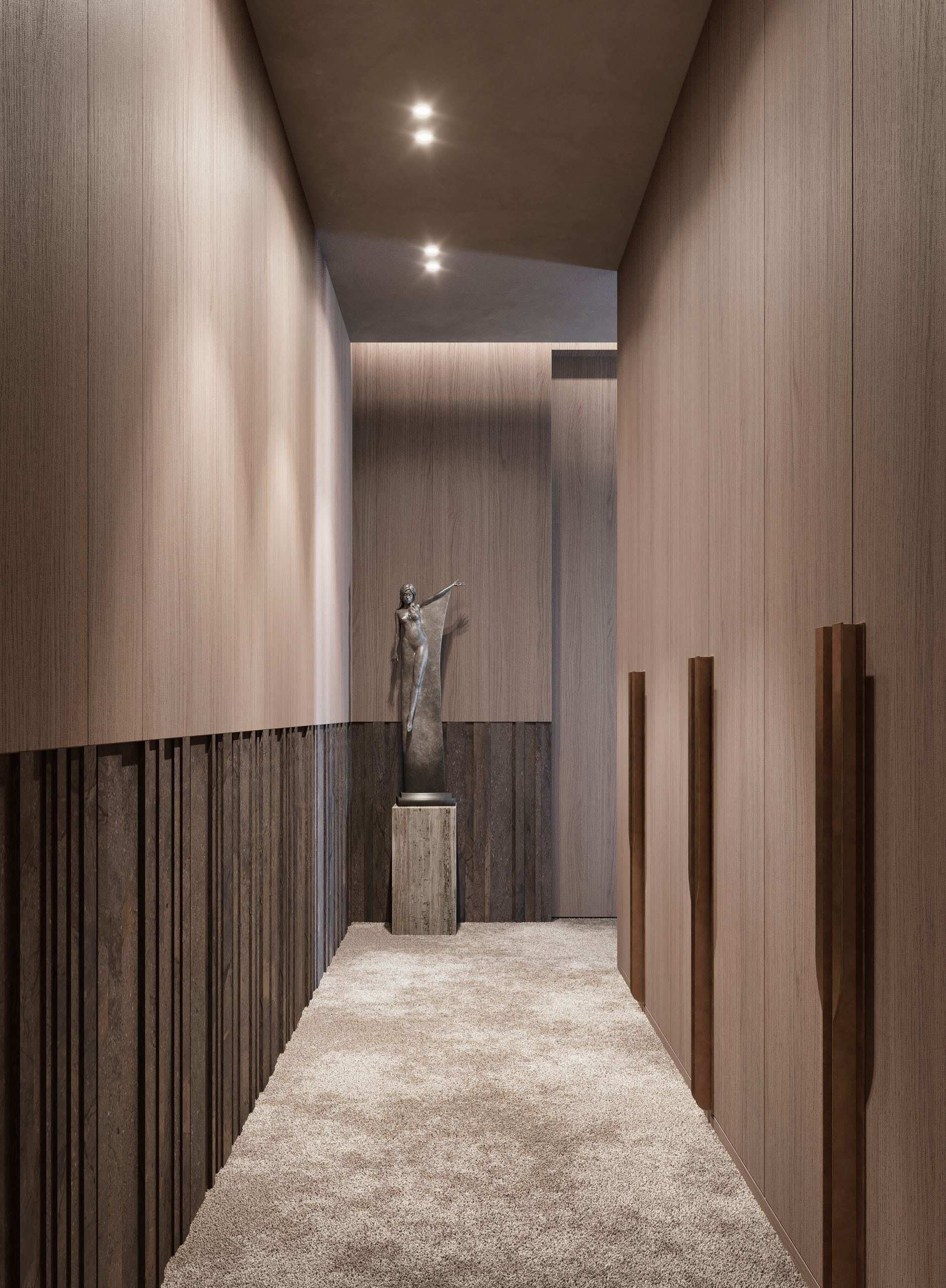 IN JAN House Interior — corridor beside a sculptural figure and timber panelling