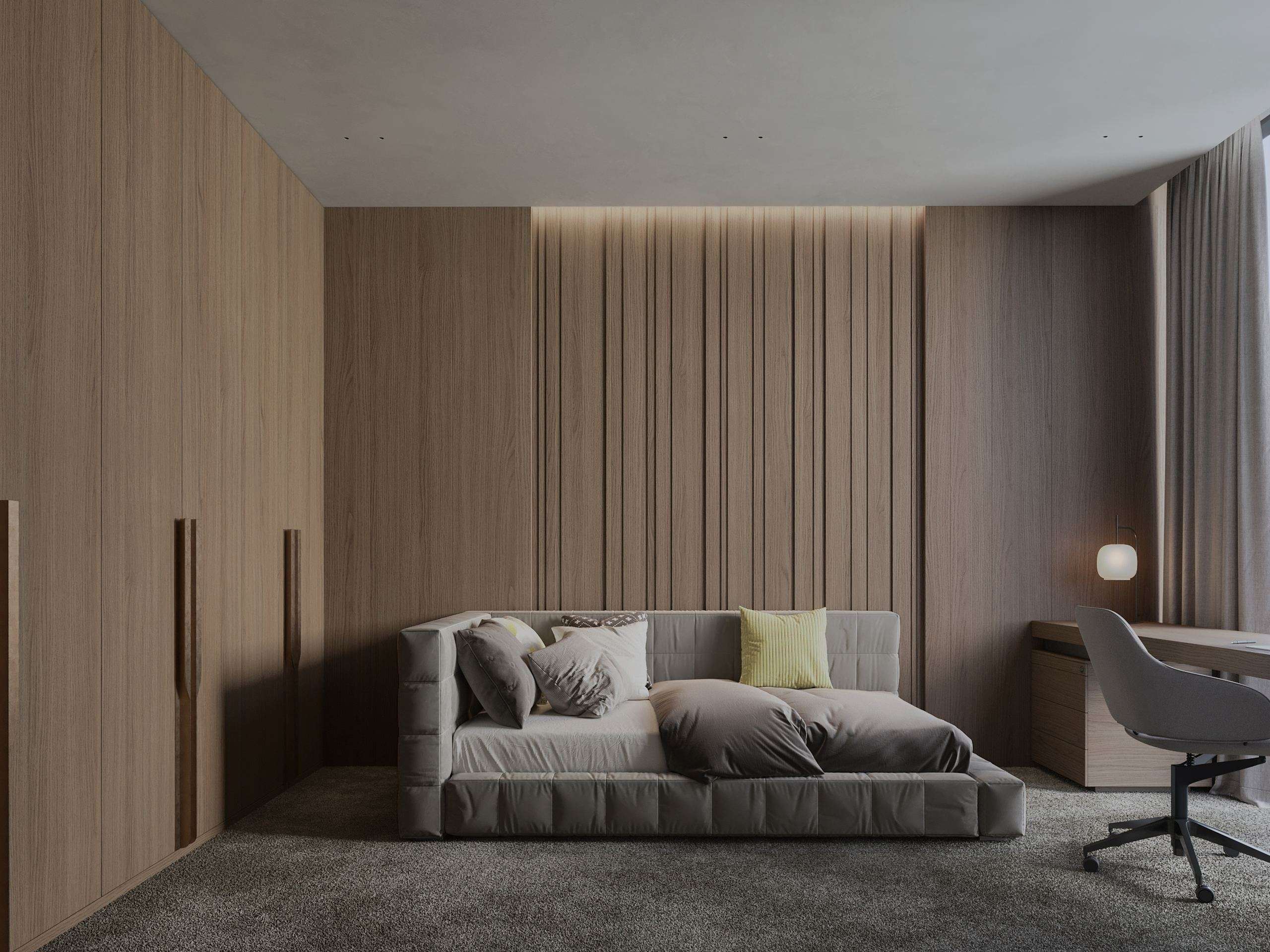 IN JAN House Interior — sofa and desk in a timber-panelled bedroom nook