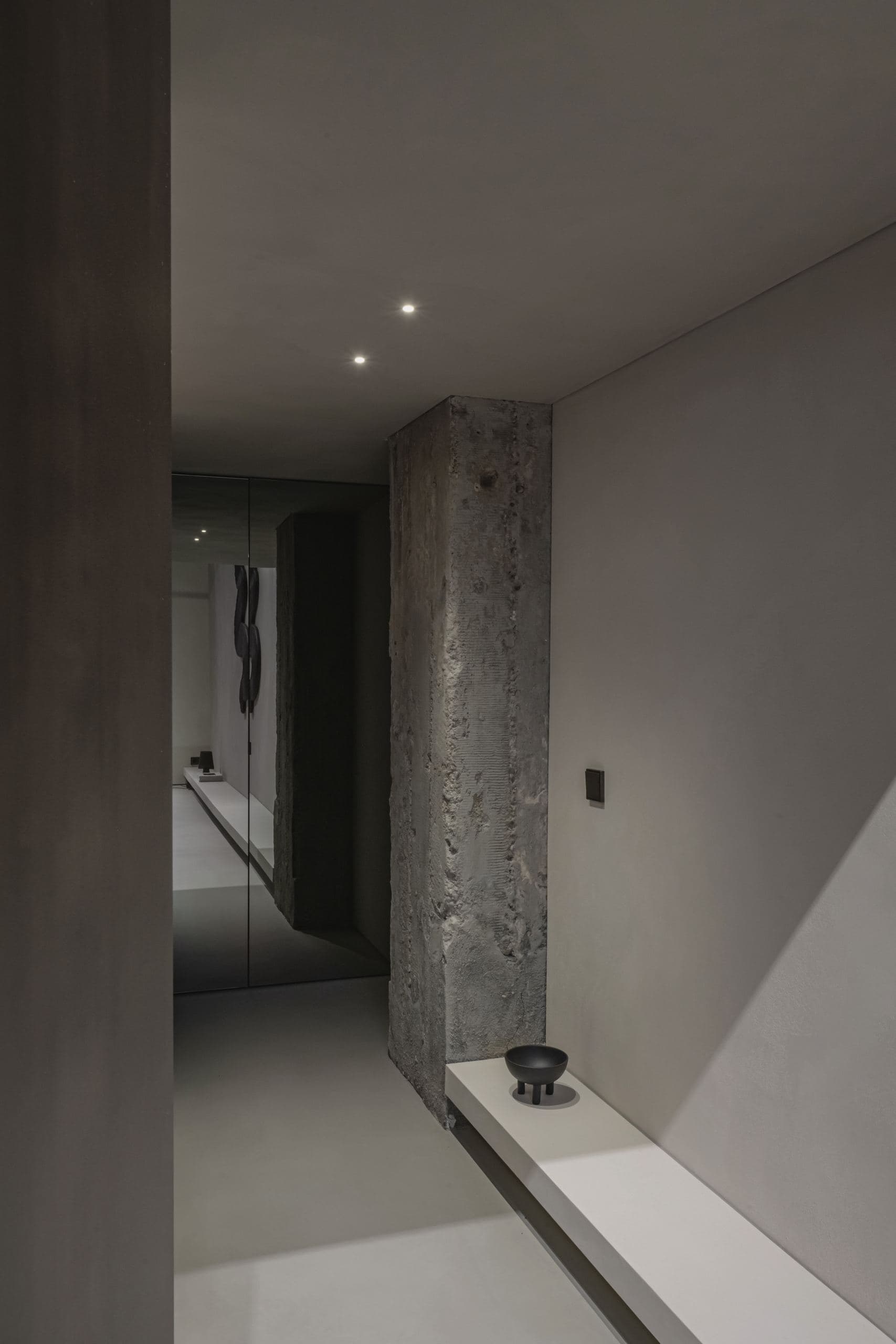 Loft Office — corridor beside a bare concrete column