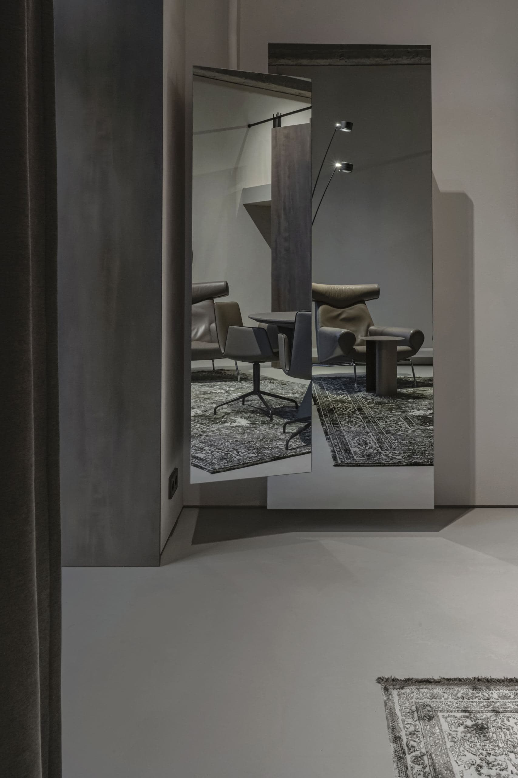 Loft Office — meeting table and chairs reflected in a full-height mirror