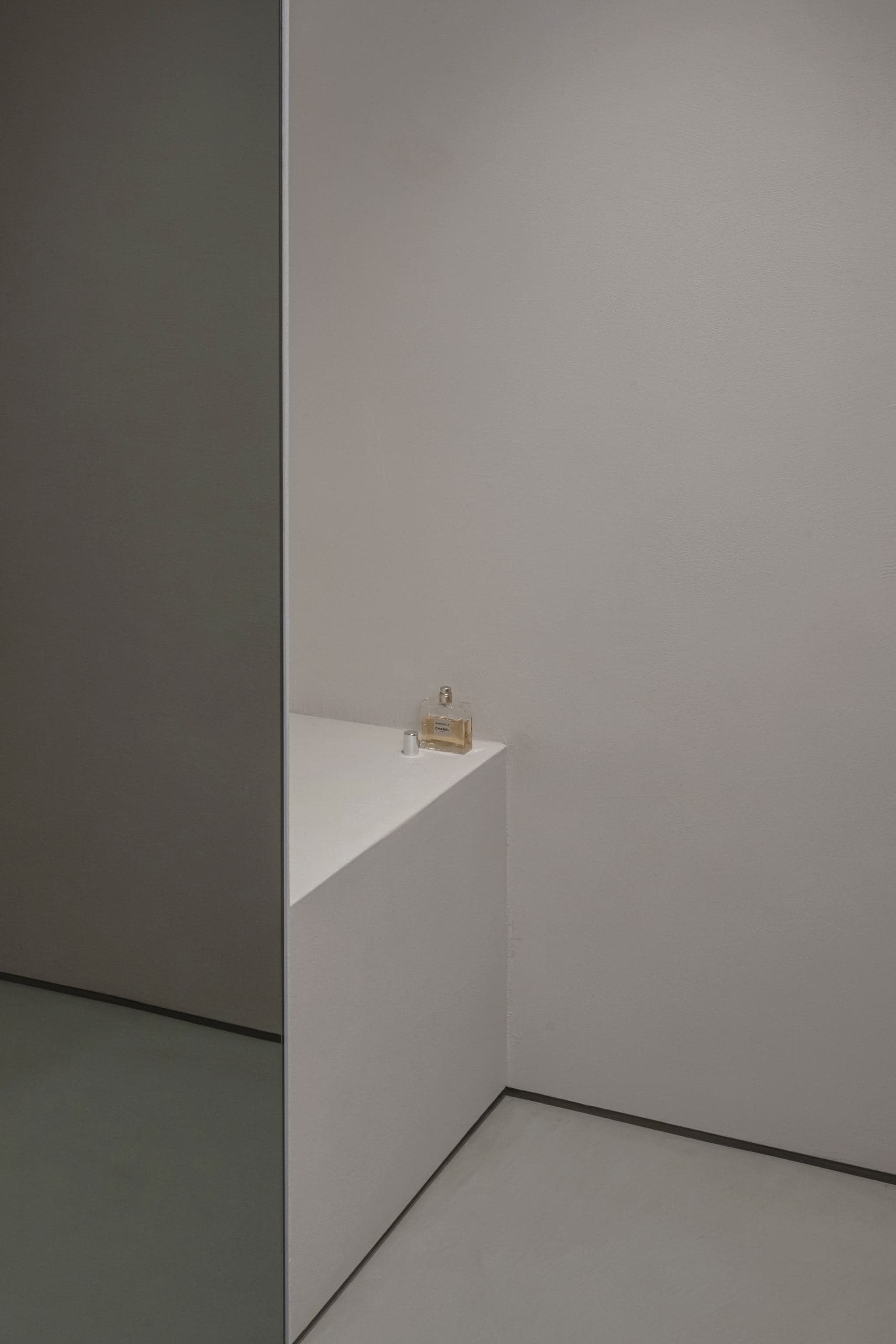 Loft Office — white corner wall catching soft daylight