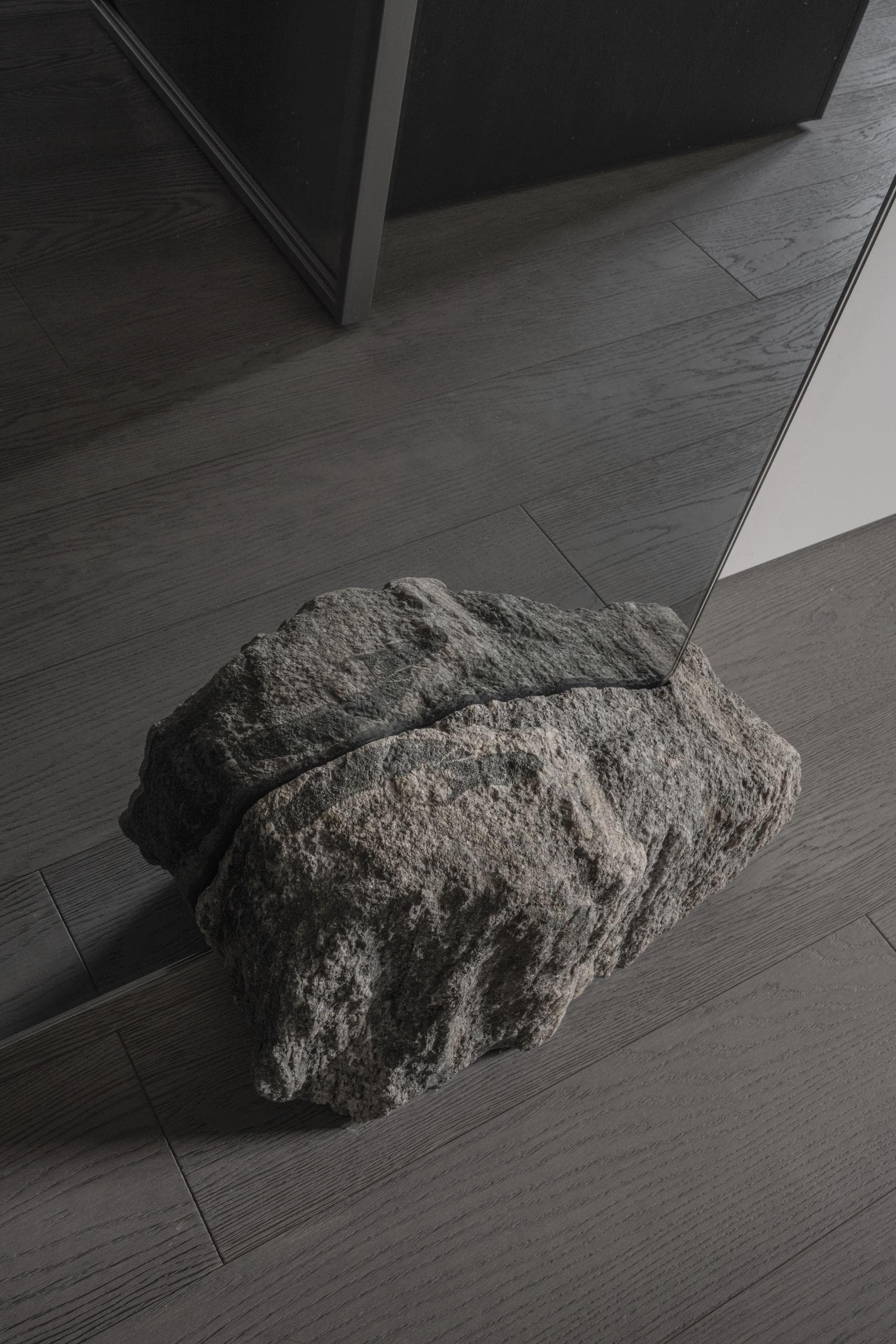 Paupys Apartment — textured stone object resting on the floor