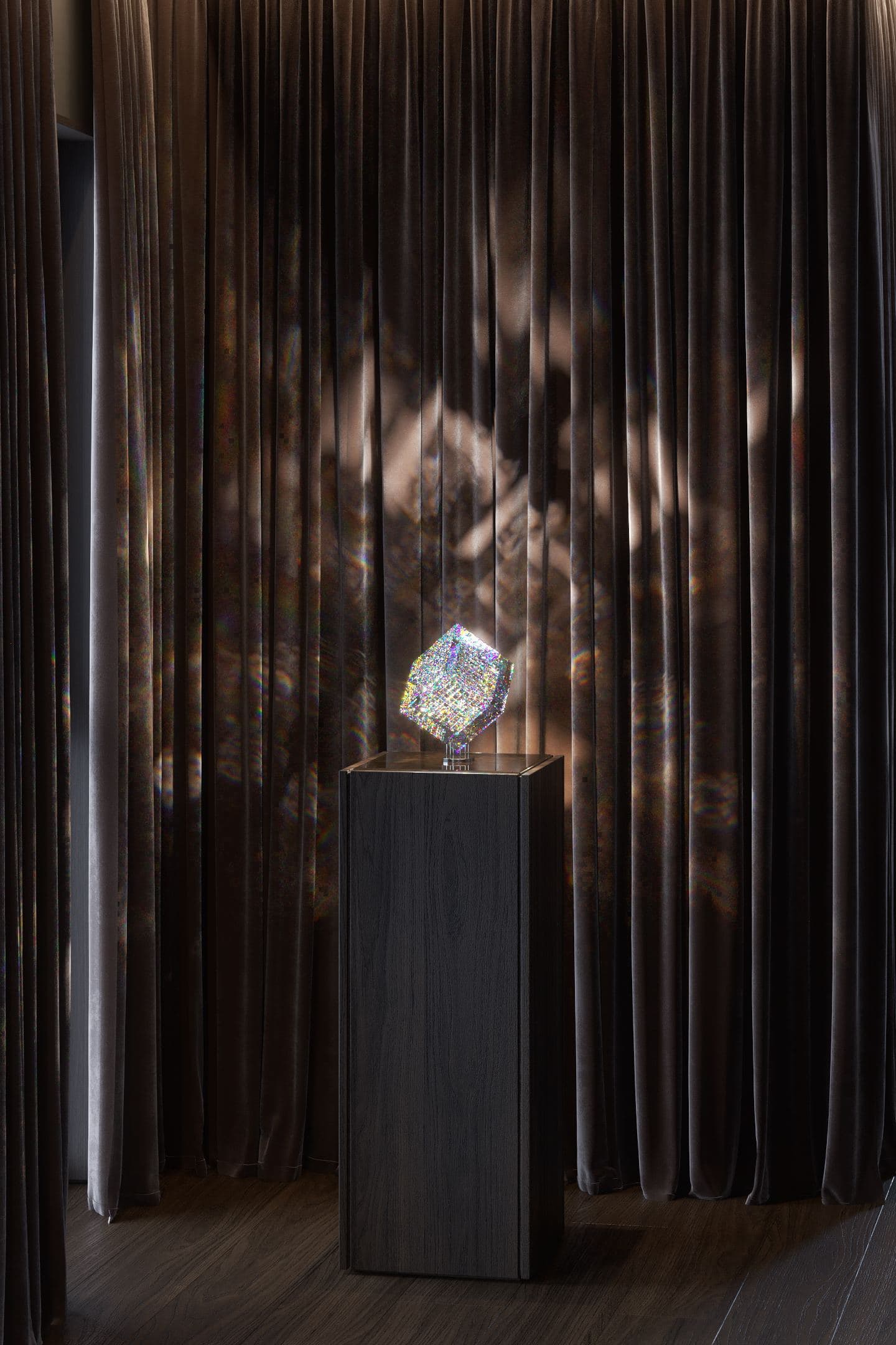 Skyline Penthouse — sculptural object lit on a pedestal beside draped curtains