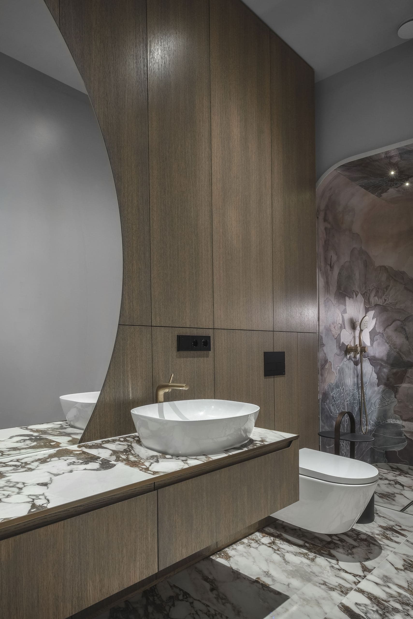 City Avenue Apartment — marble vanity with twin basins beneath a curved wood surround